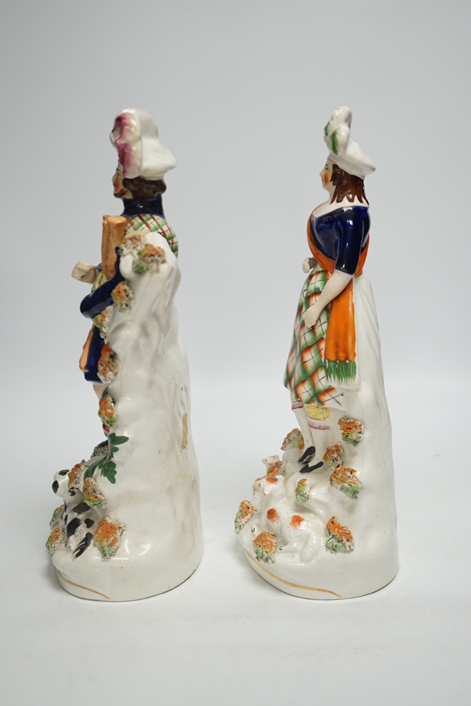 A pair of Victorian Staffordshire figures of Scots musicians